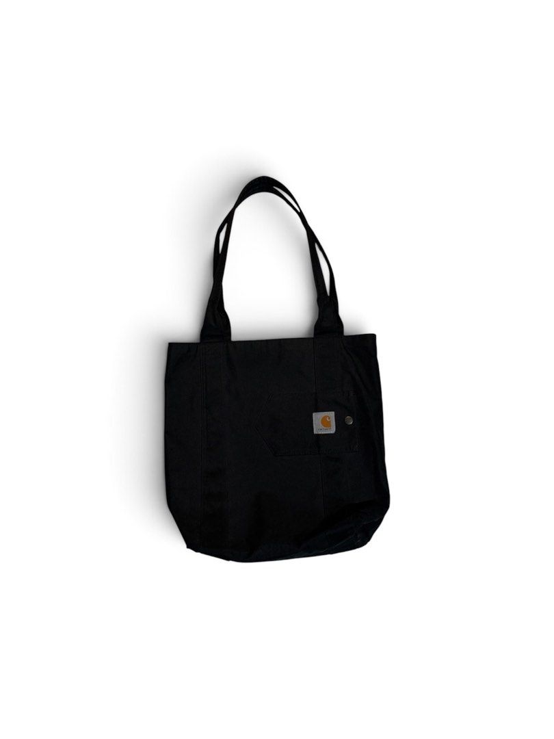 Carhartt Tote Bag (Category: Tote Bags) located in Manila. Submitted by marx_g (Listing ID 1460488111, Image 1). Description: - Two black Carhartt tote bags - Classic Carhartt patch logo on front pocket - Durable canvas material - Ideal for groceries, work, or daily essentials - Selling as a pair.