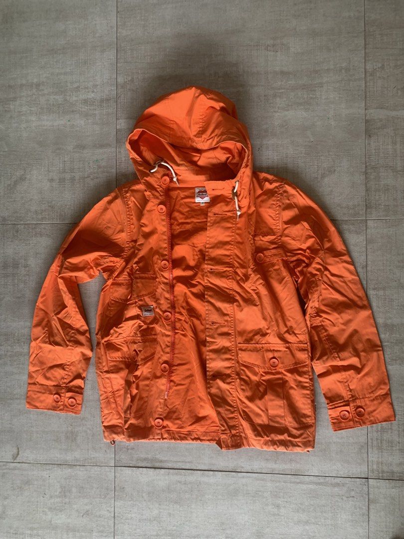 Carhartt Work In Progress Filmore Jacket Orange Size S (Category: Coats, Jackets and Outerwear) located in San Mateo. Submitted by gunmetalsteel (Listing ID 1460571762, Image 1). Description: - Orange Carhartt jacket - Hooded design - Button and zip closure - Multiple front pockets - Multiple inside pockets - Drawstring hem - Made from cotton and polyester blend - Ideal for everyday wear - has discoloration signs of wear. .