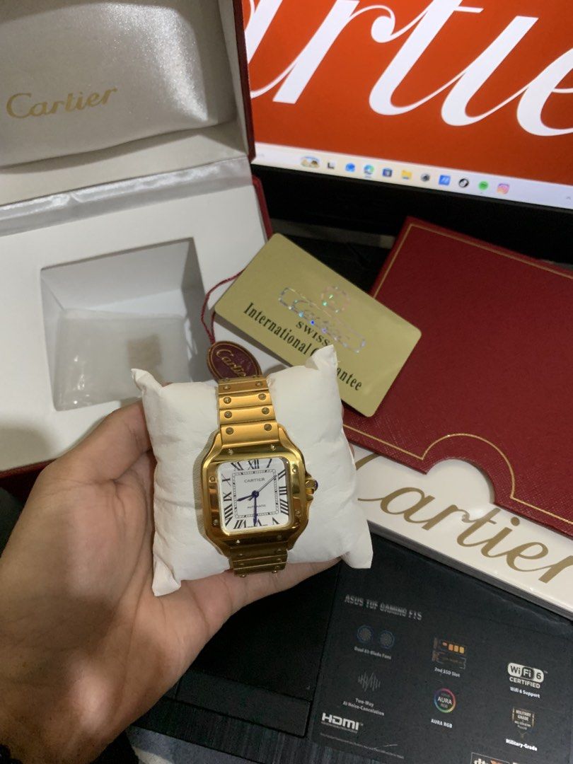 Cartier Santos Galbee Automatic Gold Watch (Category: Luxury Watches) located in Dasmarinas. Submitted by prerogathrift (Listing ID 1460713986, Image 2). Description: -mid tier watch - Cartier Santos Galbee Automatic Watch - Luxurious Gold Casing - Classic Roman Numeral Dial - Signature Blue Hands - Comes with Box - Includes International Guarantee Card .