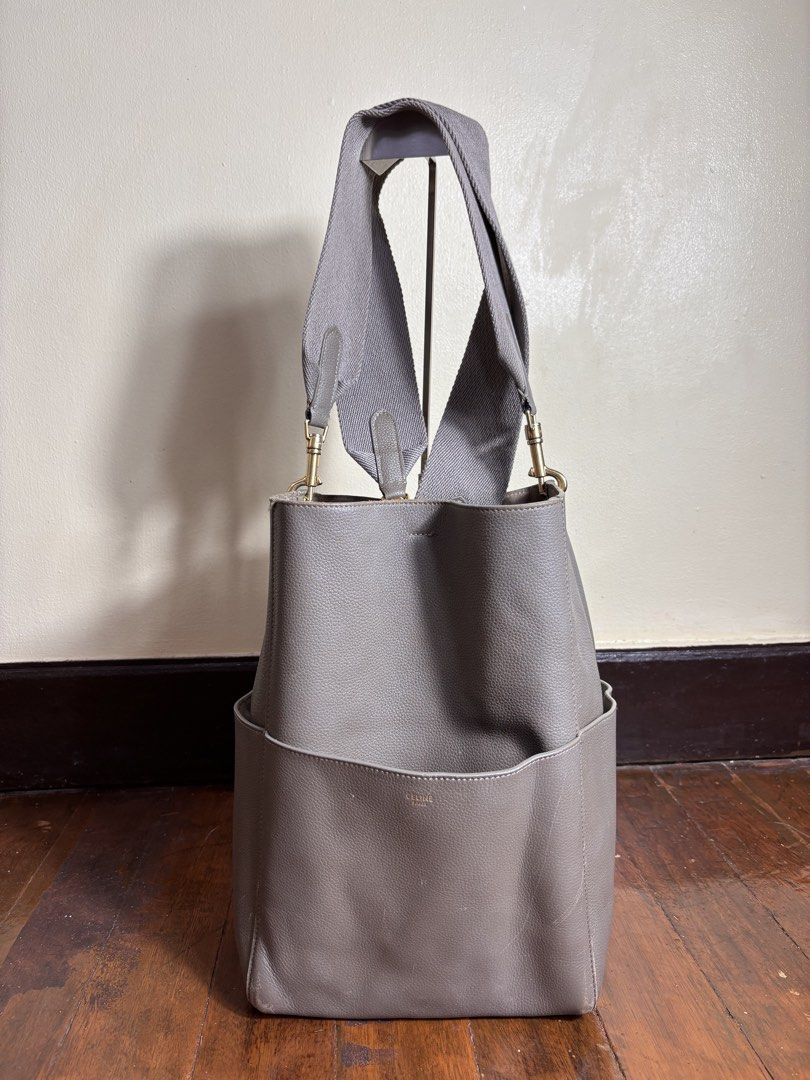 Celine Sangle Bucket Bag (Category: Luxury Bags & Wallets) located in Manila. Submitted by earlylifecrisis3 (Listing ID 1460582908, Image 1). Description: Condition 8/10 Measure it by inch Width: 11.5 Length: 13 Depth: 7 Handle: 14.5 •Refund / Returns not allowed allowed •Please do check the dimensions size on labels sometimes are not accurate on the sizing •Ask me before purchasing.