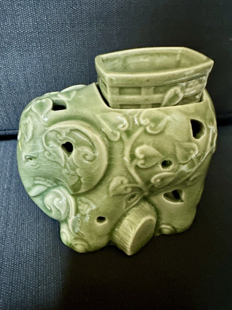 Ceramic Light Green Ceramic Elephant Essential Oil Diffuser, Aromatherapy Burner (Category: Other Home Decor) located in Quezon City. Submitted by shopaholic.kart2021 (Listing ID 1460656034, Image 1). Description: -Decorative ceramic oil burner in a light green color with elephant design. -Place the aromatic oil of your choice on top and a tea light on the bottom. With the temperature the oil will release its aroma and it will spread in the space