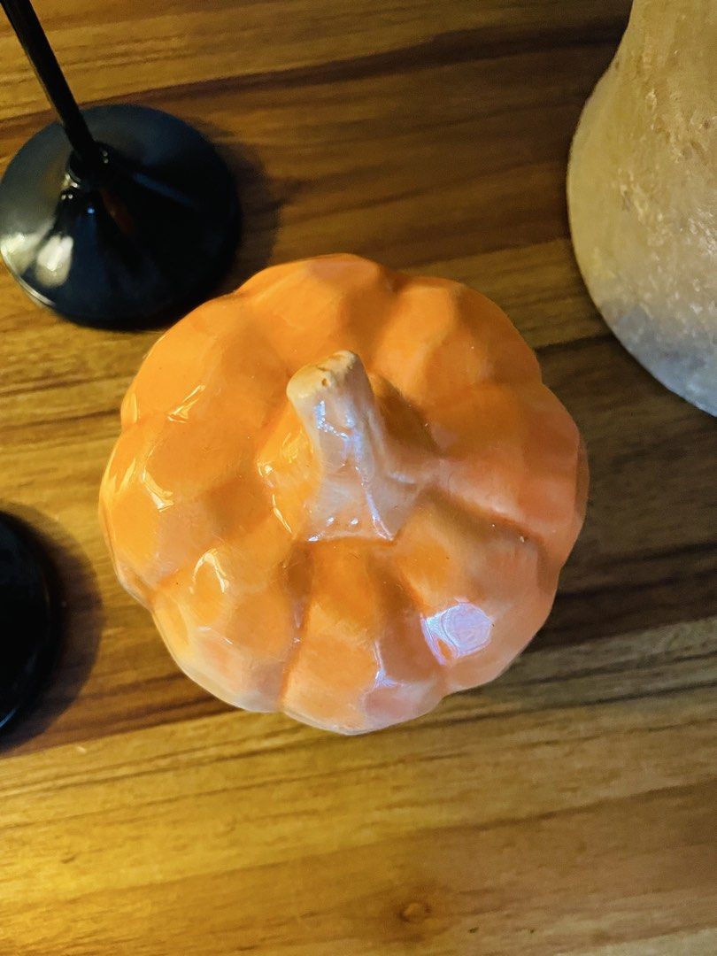 Ceramic Pumpkin Decor (Category: Other Home Decor) located in Quezon City. Submitted by catlover18 (Listing ID 1460554995, Image 3). Description: - 4inch height - Glossy orange ceramic finish - Classic pumpkin shape with textured ridges - Beautiful as a standalone accent piece - Perfect for fall, Halloween, Thanksgiving, or everyday autumn décor - Great for coffee tables, shelves, consoles, dining tables, or mantels - Condition: pre-owned, faded 