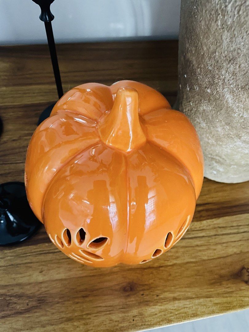 Ceramic Pumpkin Fall Decor (Category: Other Home Decor) located in Quezon City. Submitted by catlover18 (Listing ID 1460553112, Image 2). Description: - 7inch height including stem -Vibrant glossy orange finish -Decorative cutout pattern for beautiful light effects -Classic pumpkin shape with stem detail -Perfect for Halloween, fall decorating, or seasonal displays Looks great on a dining table, console, mantel, or entryway -Condition: Excellent 