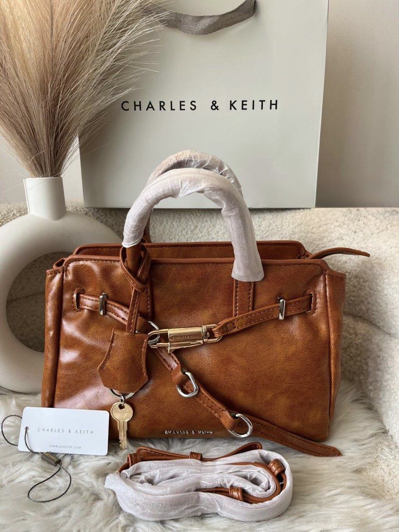 Charles & Keith Belted Tote Bag - Brown (Category: Tote Bags) located in Pasig City. Submitted by preloved.closet2 (Listing ID 1460704222, Image 1). Description: Tote with Sling Color distressed brown Add paperbag plus 80 .