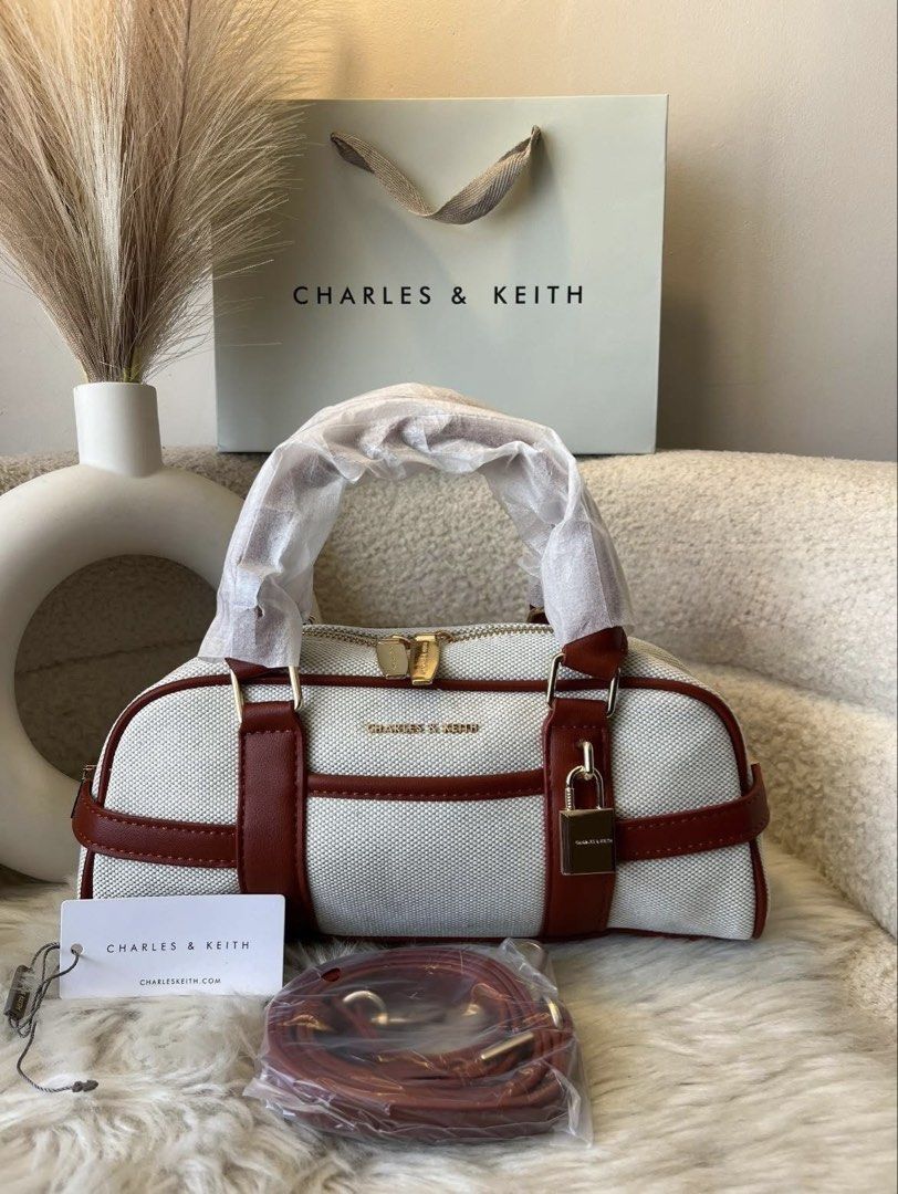 Charles & Keith Scottie Bowling Bag (Category: Cross-body Bags) located in Pasig City. Submitted by preloved.closet2 (Listing ID 1460704461, Image 1). Description: Fixed price Color canvas 2tone With Sling Add paperbag plus 80 .