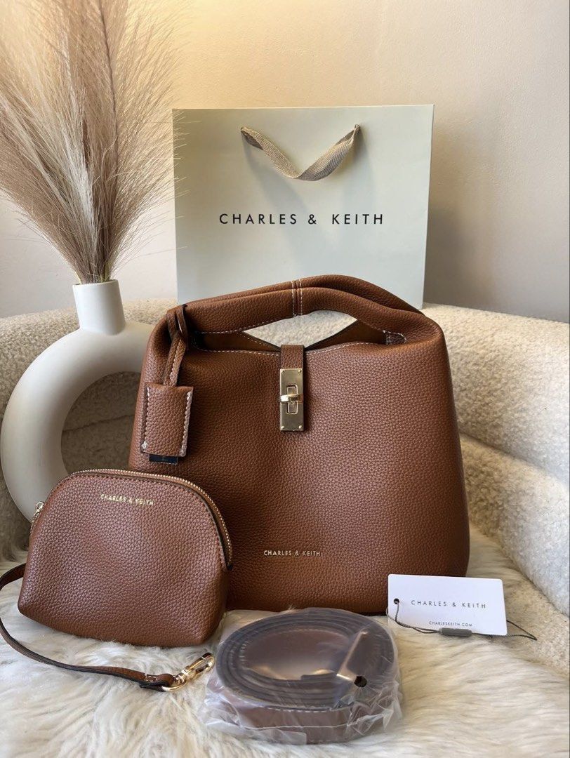 Charles & Keith turn lock bag with pouch - Brown (Category: Shoulder Bags) located in Pasig City. Submitted by preloved.closet2 (Listing ID 1460637748, Image 1). Description: With pouch With sling Add paperbag plus 80 .