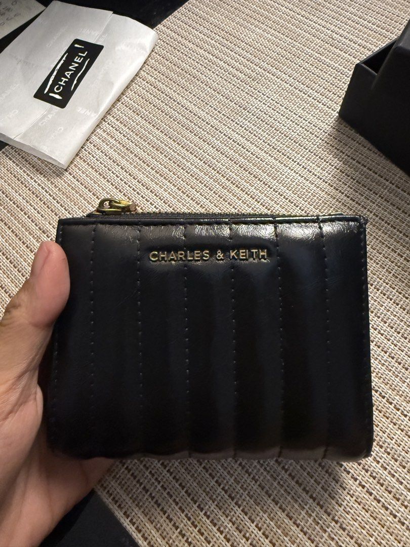 Charles and Keith wallet (Category: Wallets & Card holders) located in Quezon City. Submitted by luna111403 (Listing ID 1460601787, Image 1). Description: Preloved charles and keith short wallet. .