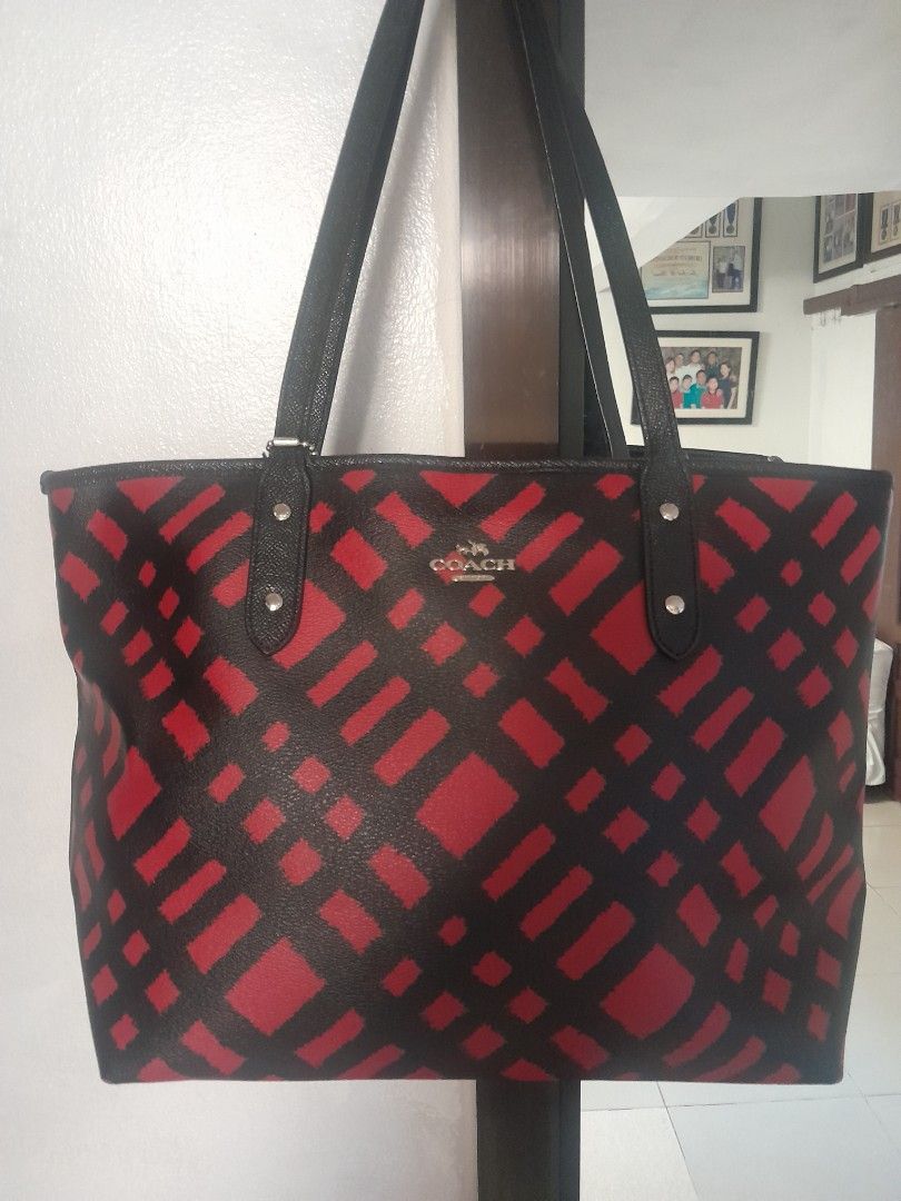 Coach Black Red Geometric Print Tote Bag (Category: Tote Bags) located in Manila. Submitted by glengpascu18784 (Listing ID 1460583830, Image 1). Description: - Stylish Coach tote bag - Eye-catching black and red geometric pattern - Genuine leather handles and trim - Secure zipper closure for the main compartment - Interior zippered pocket and slip pockets - Ample space for daily essentials - Ideal for work or casual outings.