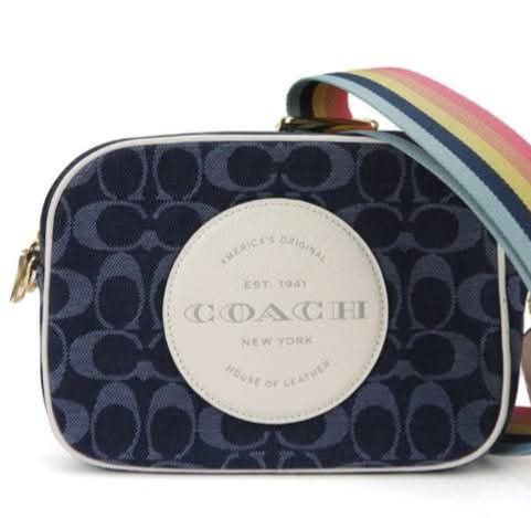 Sa interested Pa-PM sa FB ko Libra de Ana... Coach Denim Signature Camera Bag with Rainbow Strap (Category: Luxury Bags & Wallets) located in Cabanatuan. Submitted by almaespino24263 (Listing ID 1460676851, Image 1). Description: - Coach camera bag - Signature denim jacquard with all-over 'C' pattern - Comes with a fun rainbow striped strap - White circular patch on the front with Coach New York branding - Ideal for everyday use or travel.