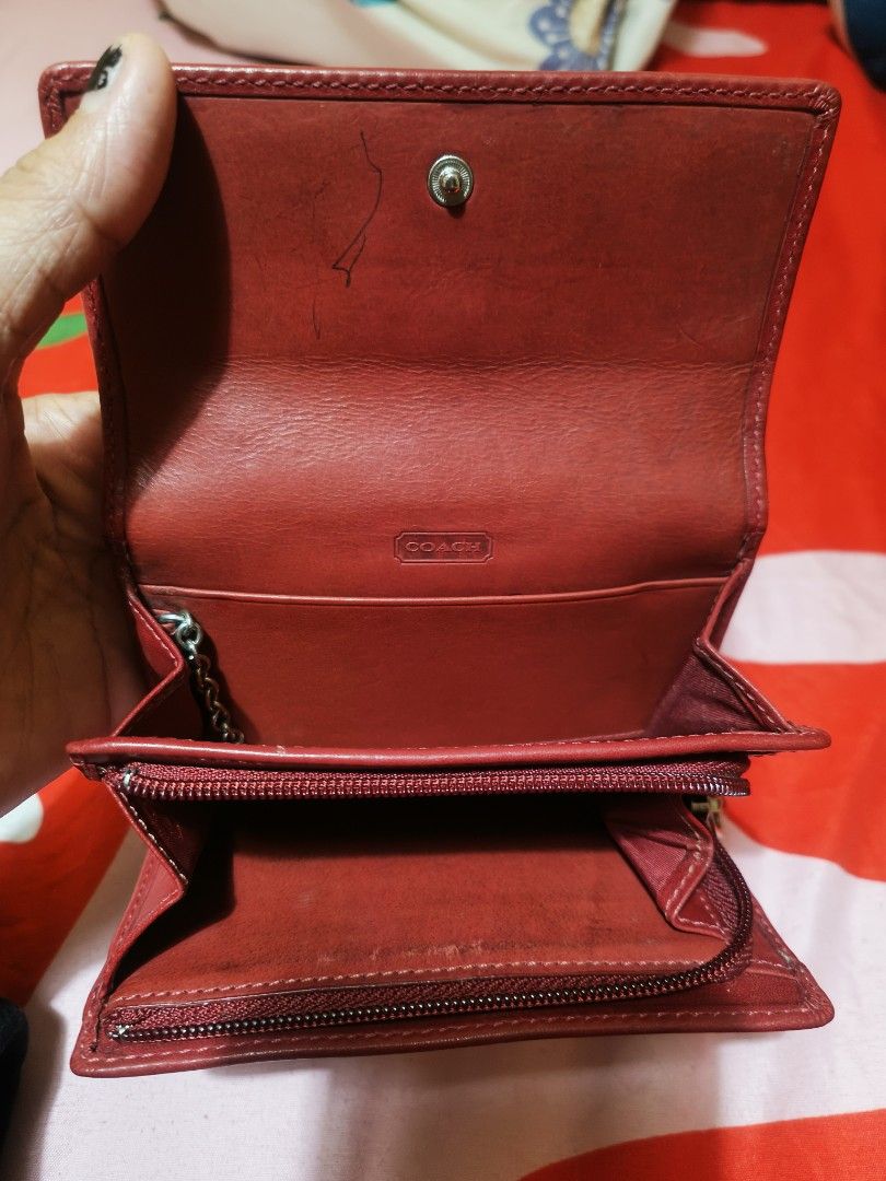 Coach Leatherware Est. 1941 Red Tri-Fold Wallet (Category: Wallets & Card holders) located in Cebu City. Submitted by elen30abalo (Listing ID 1460665447, Image 2). Description: - Vintage Red Coach tri-fold wallet - Genuine leather material - Secure snap closure - Convenient zippered coin pocket - Multiple interior card slots and bill compartments - Shows some signs of wear (exterior & interior), as pictured - Fully functional and retains its styl