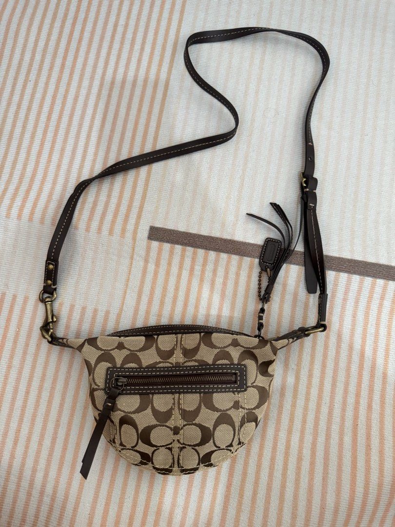 Coach Monogram Canvas Crossbody Bag (Category: Luxury Bags & Wallets) located in Malolos. Submitted by ebc17 (Listing ID 1460536248, Image 1). Description: - Classic Coach monogram canvas crossbody bag - Color: Brown and tan signature 'C' pattern - Material: Canvas with leather trim and strap - Closure: Zipper - Features: Front zip pocket, adjustable strap - Ideal for: Everyday use.