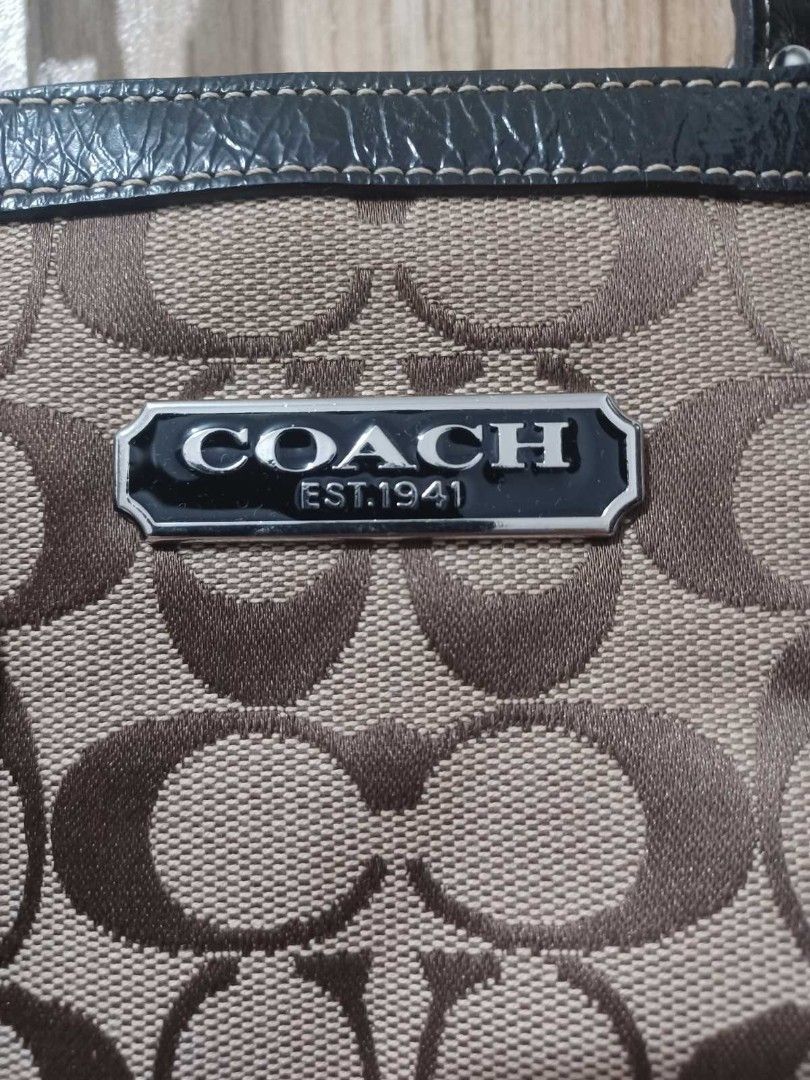 Coach Monogram Canvas Leather Trim Tote Bag (Category: Luxury Bags & Wallets) located in Quezon City. Submitted by npmrcl (Listing ID 1460515738, Image 3). Description: - Classic Coach monogram canvas tote - Dark leather trim and handles - Spacious interior - Interior zippered compartment - Includes Coach leather hangtag - Ideal for everyday use.