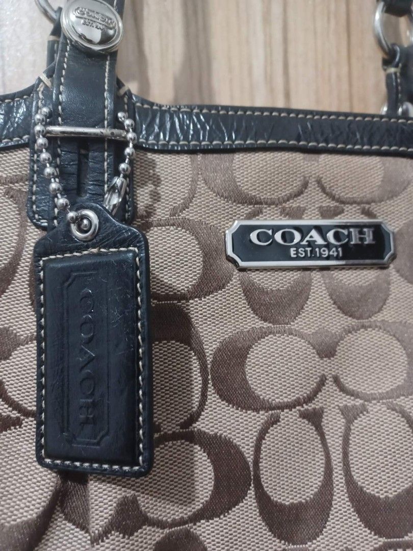 Coach Monogram Canvas Leather Trim Tote Bag (Category: Luxury Bags & Wallets) located in Quezon City. Submitted by npmrcl (Listing ID 1460515738, Image 2). Description: - Classic Coach monogram canvas tote - Dark leather trim and handles - Spacious interior - Interior zippered compartment - Includes Coach leather hangtag - Ideal for everyday use.
