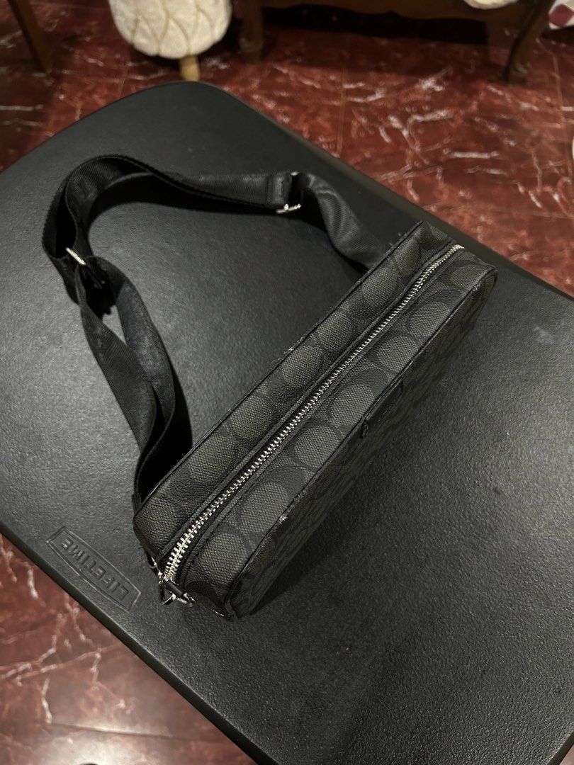 Coach Monogram Crossbody Bag Black (Category: Luxury Bags & Wallets) located in Manila. Submitted by drilskie0954204 (Listing ID 1460515944, Image 3). Description: - Authentic Coach crossbody bag - All-over signature monogram pattern - Secure zip closure - Adjustable strap for comfortable wear - Ideal for everyday use, fits all your essentials - Clean and simple design.