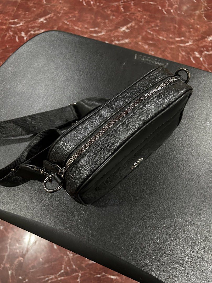 Coach Monogram Crossbody Bag Black (Category: Luxury Bags & Wallets) located in Manila. Submitted by drilskie0954204 (Listing ID 1460516189, Image 2). Description: - Authentic Coach crossbody bag - Signature all-over monogram pattern - Main zippered compartment - Front pocket for easy access - Adjustable strap with Coach branding - Ideal for everyday use - Please check photos for detailed condition.