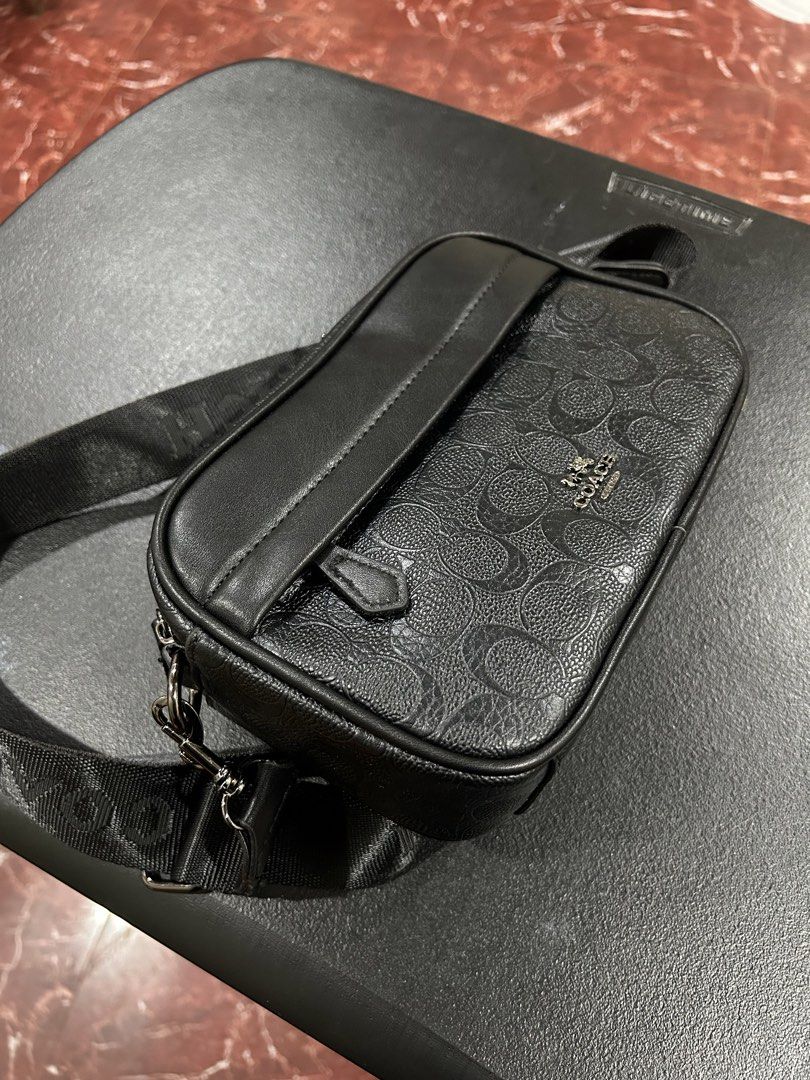 Coach Monogram Crossbody Bag Black (Category: Luxury Bags & Wallets) located in Manila. Submitted by drilskie0954204 (Listing ID 1460516189, Image 3). Description: - Authentic Coach crossbody bag - Signature all-over monogram pattern - Main zippered compartment - Front pocket for easy access - Adjustable strap with Coach branding - Ideal for everyday use - Please check photos for detailed condition.