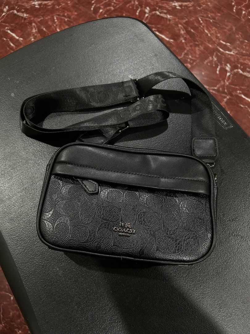 Coach Monogram Crossbody Bag Black (Category: Luxury Bags & Wallets) located in Manila. Submitted by drilskie0954204 (Listing ID 1460516189, Image 1). Description: - Authentic Coach crossbody bag - Signature all-over monogram pattern - Main zippered compartment - Front pocket for easy access - Adjustable strap with Coach branding - Ideal for everyday use - Please check photos for detailed condition.