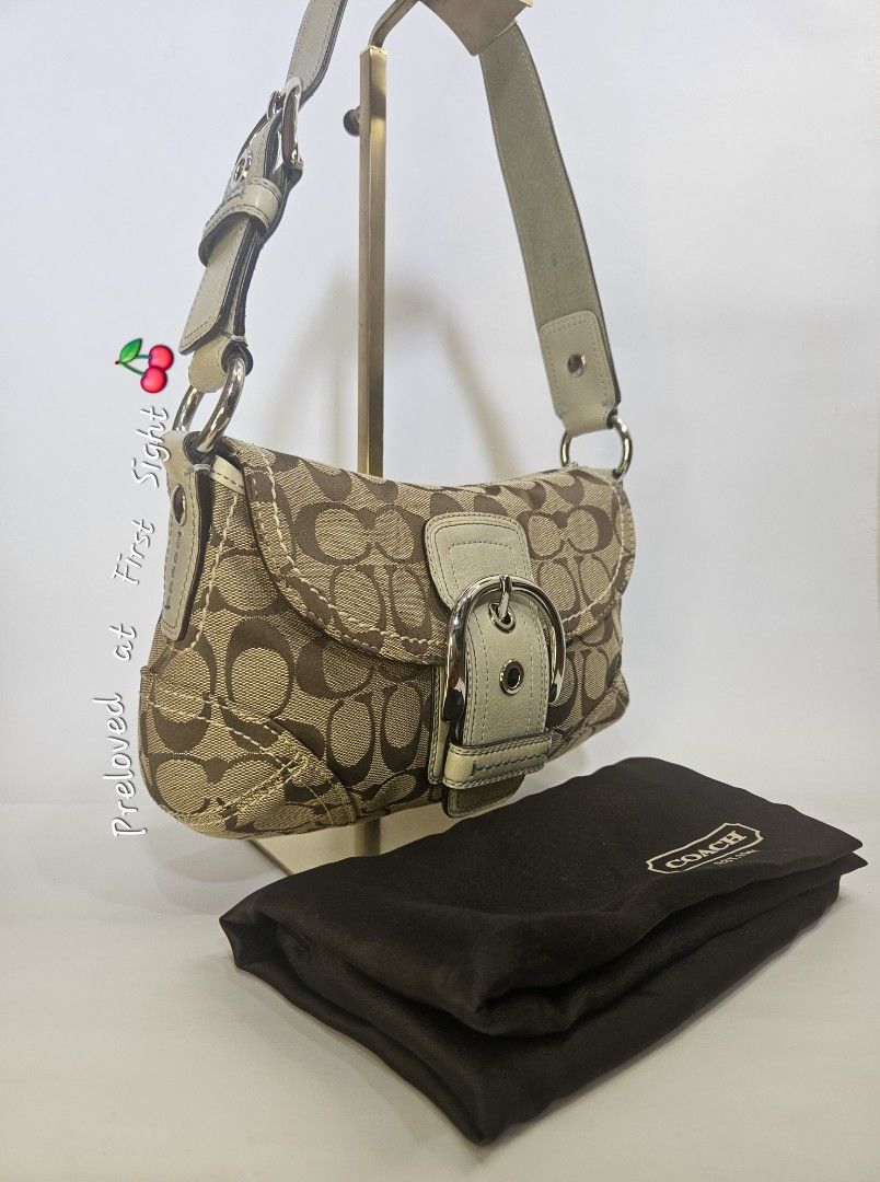 Coach Monogram Shoulder Bag (Category: Luxury Bags & Wallets) located in Balanga. Submitted by prelovedat1stsight (Listing ID 1460616559, Image 2). Description: - Authentic Coach monogram shoulder bag - Classic brown and tan signature pattern - Cream leather trim and adjustable strap - Silver buckle detail on the front flap - Comes with original Coach dust bag - A timeless and iconic Coach accessory - Rank A condition.