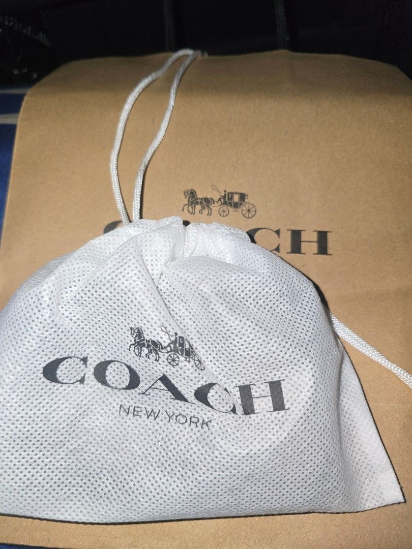 Coach New York Monogram Zip Around Wallet (Category: Wallets & Card holders) located in Manila. Submitted by nyaowz (Listing ID 1460556960, Image 3). Description: - Authentic Coach wallet - Signature monogram print - Black color - Zip-around closure - Compact size, ideal for cards and coins - Comes with original dust bag and shopping bag.