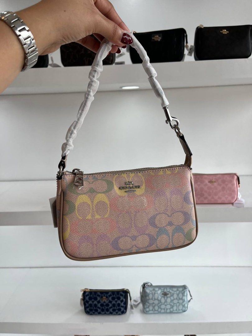 Coach Nolita 19cm (Category: Clutches) located in Manila. Submitted by strwbrry.cheesecake (Listing ID 1460682709, Image 2). Description: - Pre order, no rush shipping - Open for bulk orders (DM for bulk price) - Brand New - DM us on ig @shopatloveluxeph for faster transaction .