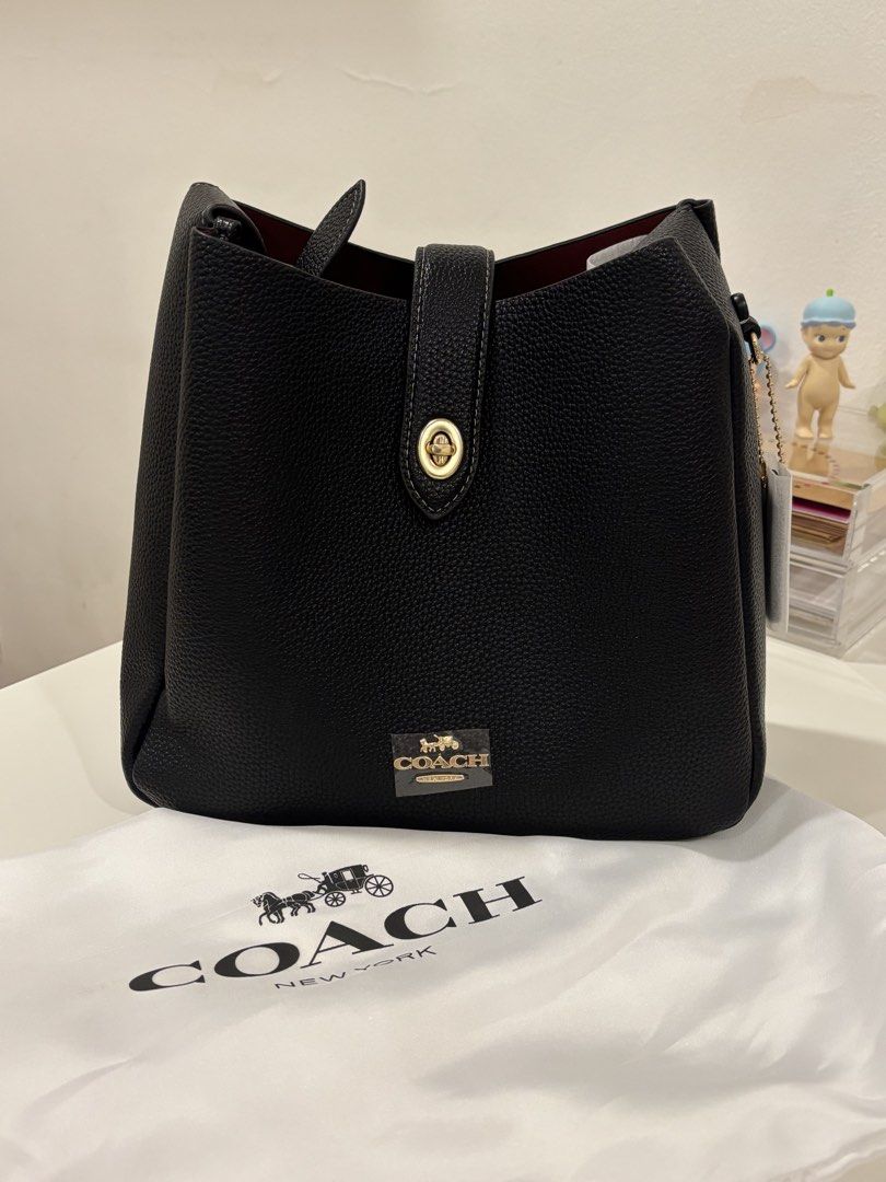 Coach Pebble Leather Bucket Bag Black (Category: Luxury Bags & Wallets) located in Manila. Submitted by khloesmom (Listing ID 1460639830, Image 1). Description: - Brand: Coach - Material: Black pebbled leather - Hardware: Gold-tone - Features: Adjustable strap, interior zip pocket - Includes: Dust bag - Style: Bucket bag - Ideal for: Everyday use.