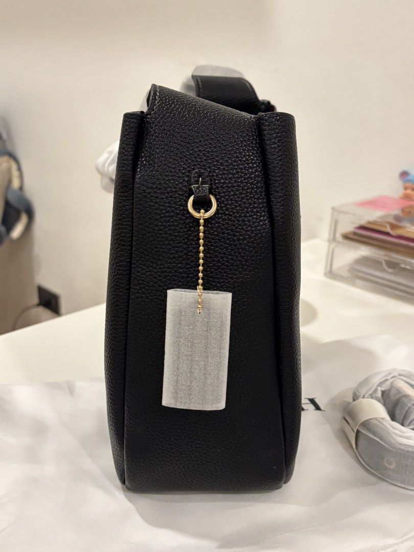 Coach Pebble Leather Bucket Bag Black (Category: Luxury Bags & Wallets) located in Manila. Submitted by khloesmom (Listing ID 1460639830, Image 3). Description: - Brand: Coach - Material: Black pebbled leather - Hardware: Gold-tone - Features: Adjustable strap, interior zip pocket - Includes: Dust bag - Style: Bucket bag - Ideal for: Everyday use.