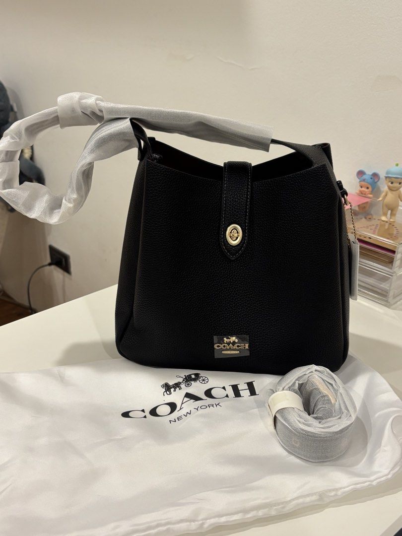 Coach Pebble Leather Bucket Bag Black (Category: Luxury Bags & Wallets) located in Manila. Submitted by khloesmom (Listing ID 1460639830, Image 2). Description: - Brand: Coach - Material: Black pebbled leather - Hardware: Gold-tone - Features: Adjustable strap, interior zip pocket - Includes: Dust bag - Style: Bucket bag - Ideal for: Everyday use.