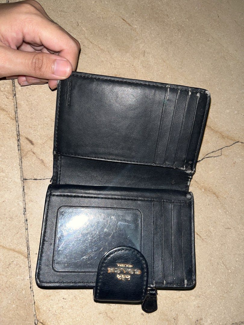 Coach Signature Canvas Trifold Wallet (Category: Luxury Bags & Wallets) located in Makati City. Submitted by aliyahprieto949 (Listing ID 1460630530, Image 3). Description: - Authentic Coach trifold wallet - Classic brown and black signature C print - Secure snap closure - Convenient zip coin pocket - Multiple interior card slots - Clear ID window - Minor signs of wear on inside edges and ID window - Plenty of life left, great value!.