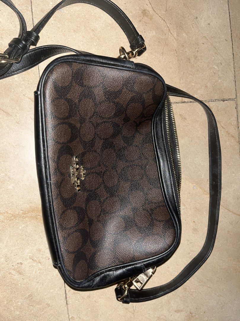 Coach Signature Monogram Crossbody Bag (Category: Luxury Bags & Wallets) located in Makati City. Submitted by aliyahprieto949 (Listing ID 1460629985, Image 1). Description: - Authentic Coach crossbody bag - Classic brown and black monogram pattern - Genuine leather trim and strap - Secure zipper closure - Elegant gold hardware - Adjustable strap for comfortable wear - Ideal for everyday use.