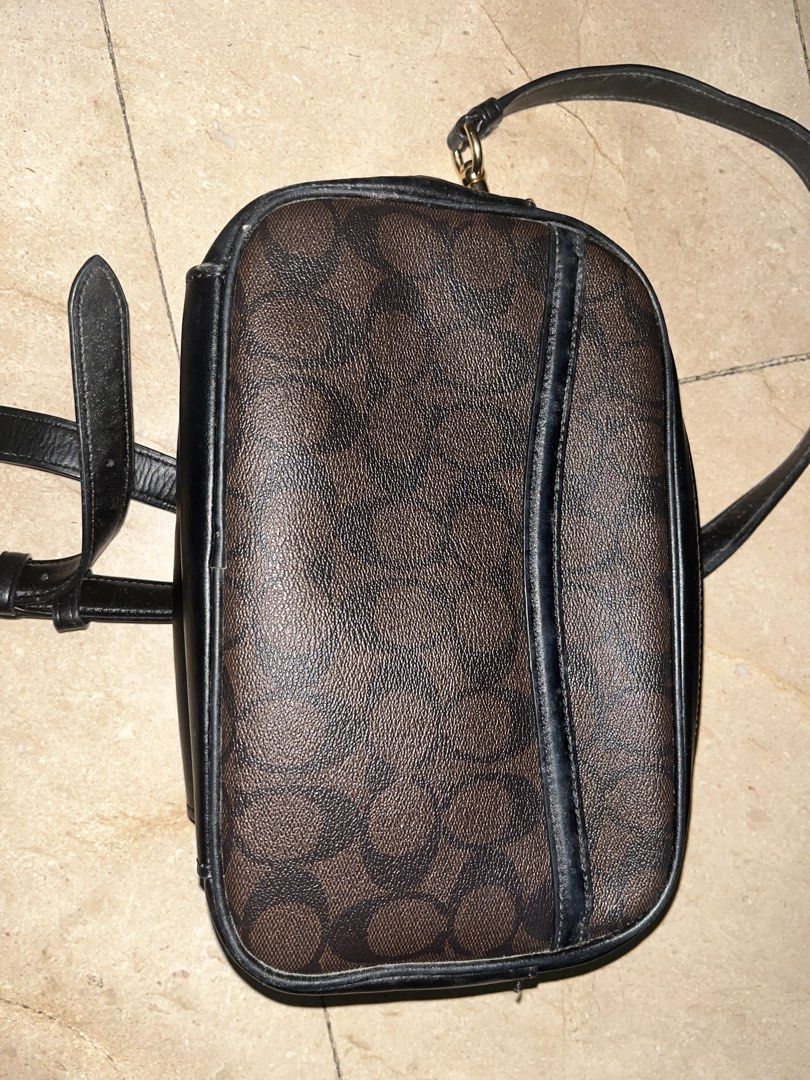Coach Signature Monogram Crossbody Bag (Category: Luxury Bags & Wallets) located in Makati City. Submitted by aliyahprieto949 (Listing ID 1460629985, Image 2). Description: - Authentic Coach crossbody bag - Classic brown and black monogram pattern - Genuine leather trim and strap - Secure zipper closure - Elegant gold hardware - Adjustable strap for comfortable wear - Ideal for everyday use.
