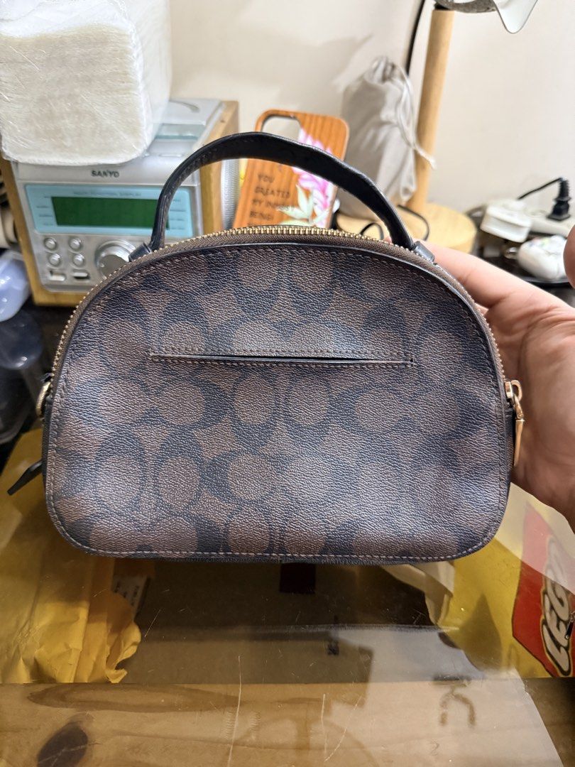 Coach Signature Monogram Dome Bag (Category: Luxury Bags & Wallets) located in Manila. Submitted by miguelitoguerrero (Listing ID 1460540431, Image 2). Description: - Authentic Coach monogram dome bag - Classic brown and tan signature print - Secure zip closure - Interior Coach leather tag with serial number - Detachable leather strap included - Small size, ideal for carrying essentials PMPM QC NEGOTIABLE .