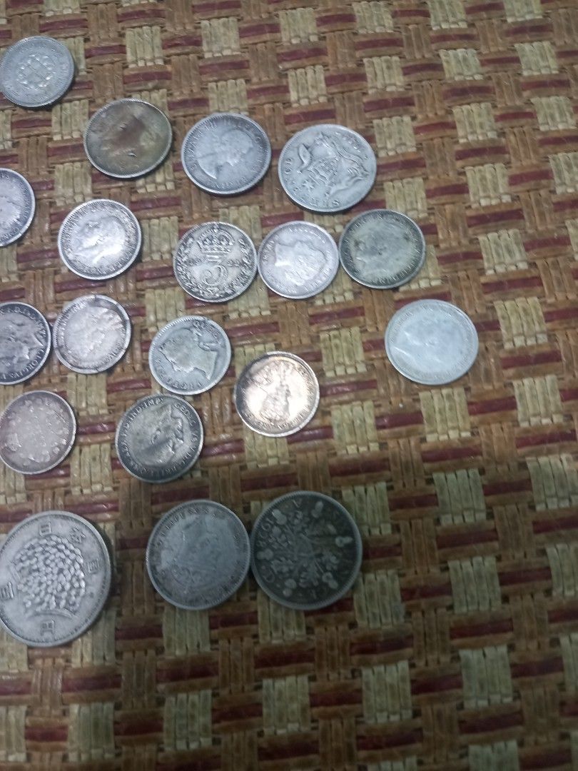 Collection of Assorted Silver and Foreign Coins (Category: Currency) located in Subic. Submitted by regiegabriel29 (Listing ID 1460519653, Image 3). Description: - Assorted coin collection - Includes silver coins and foreign currency - Features intricate designs and historical markings - Perfect for coin collectors and numismatics enthusiasts - Sold as a complete lot.