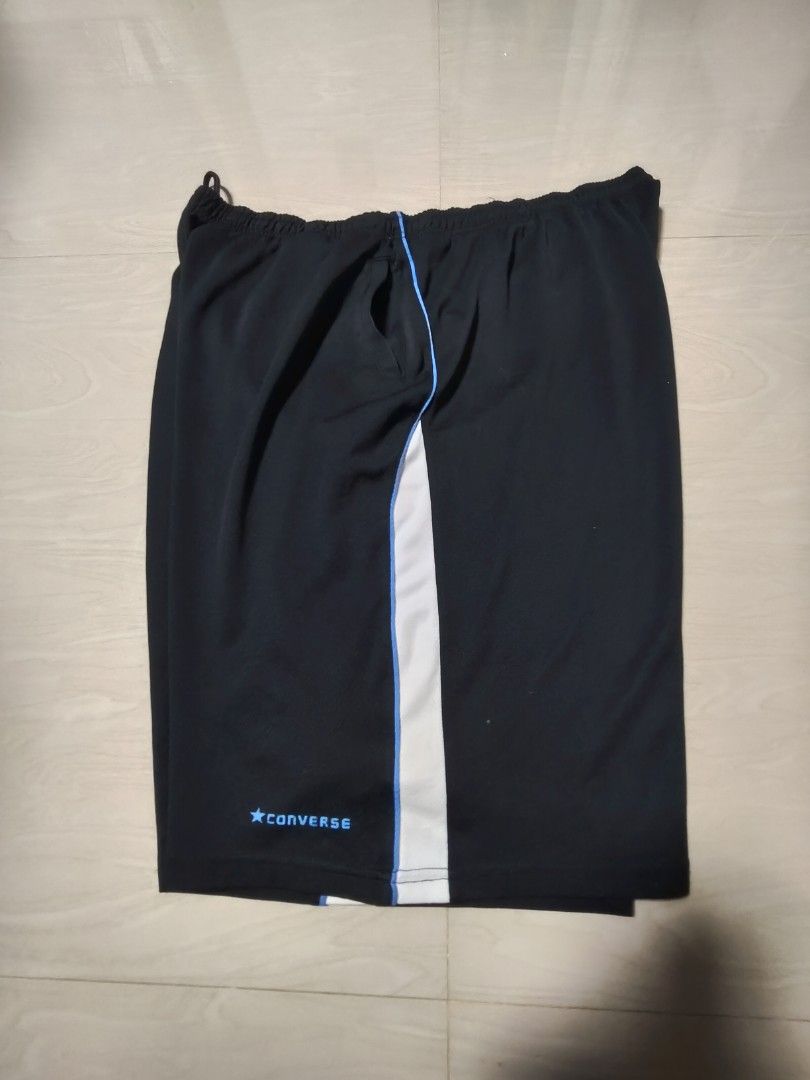 Converse Black Athletic Shorts (Category: Shorts) located in Manila. Submitted by si_yannnn (Listing ID 1460684620, Image 1). Description: - Brand: Converse - Color: Black with white and blue stripe details - Size: 4L - Features: Elastic waistband with drawstring - Ideal for: Sports or casual wear - Material: Comfortable and breathable.