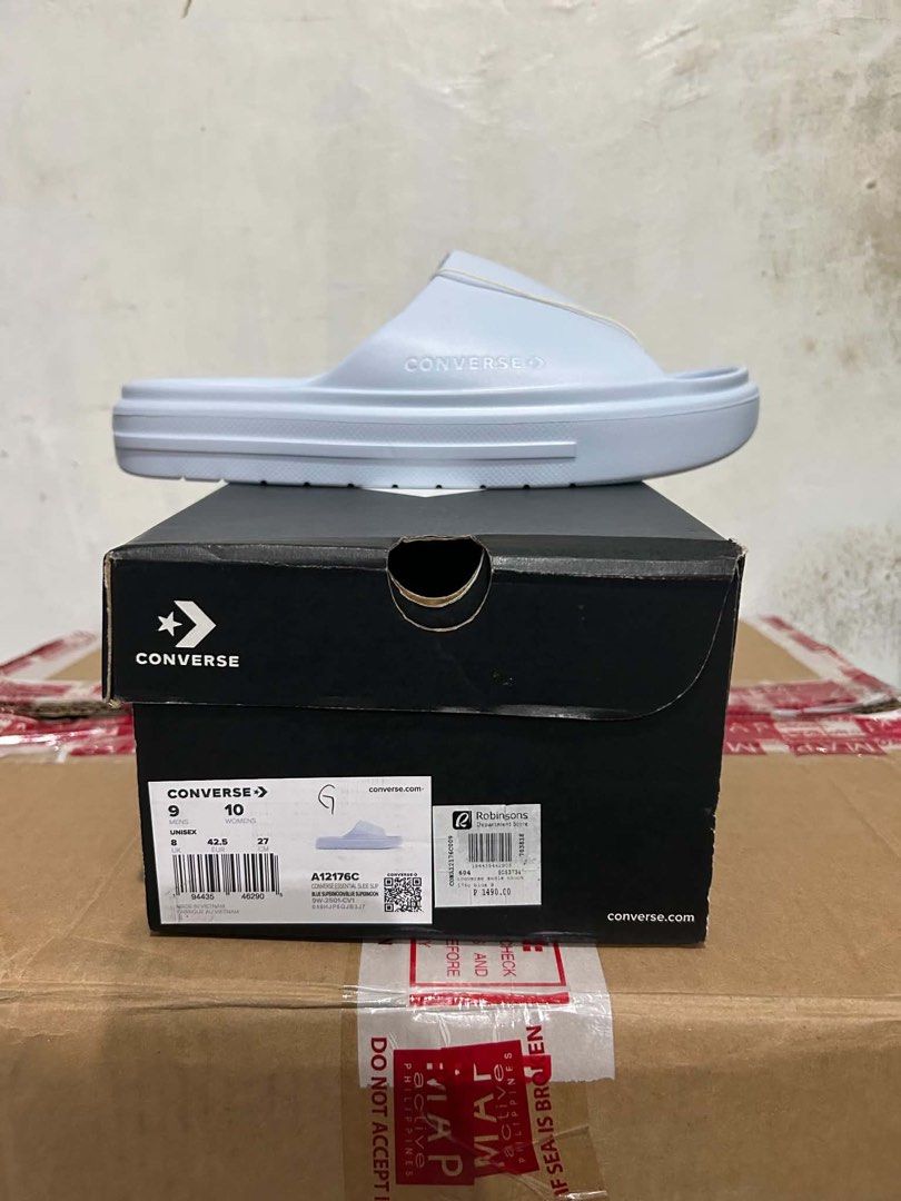 Converse Essential Slide Sup Blue Supermoon (Category: Slippers & Slides) located in Rodriguez. Submitted by leo_mjjmpj (Listing ID 1460662351, Image 1). Description: - Brand: Converse - Model: Essential Slides - Color: Blue Supermoon - Size: US Men's 9 / US Women's 10 / Unisex 27cm - Condition: Brand New - Includes: Original Box - Authenticity: Purchased from Robinsons Department Store.