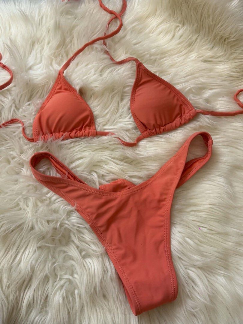 Coral Triangle Bikini Set (Category: Bikinis & Swimsuits) located in Bacoor. Submitted by hazimist (Listing ID 1460516880, Image 1). Description: - Coral colored bikini set - Triangle top with adjustable tie straps - Matching thong bottoms - Ideal for beach or pool - Perfect for your next vacation!.