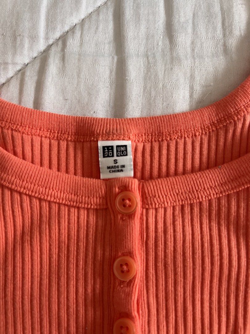 Coral Uniqlo Ribbed Buttoned Tank Top (Category: Sleeveless) located in Taguig. Submitted by gingerderp (Listing ID 1460563127, Image 2). Description: Cutest little top ever! Can be worn with soo many different colors and is in the trending color coral 😳❤️ Grab it now :) .
