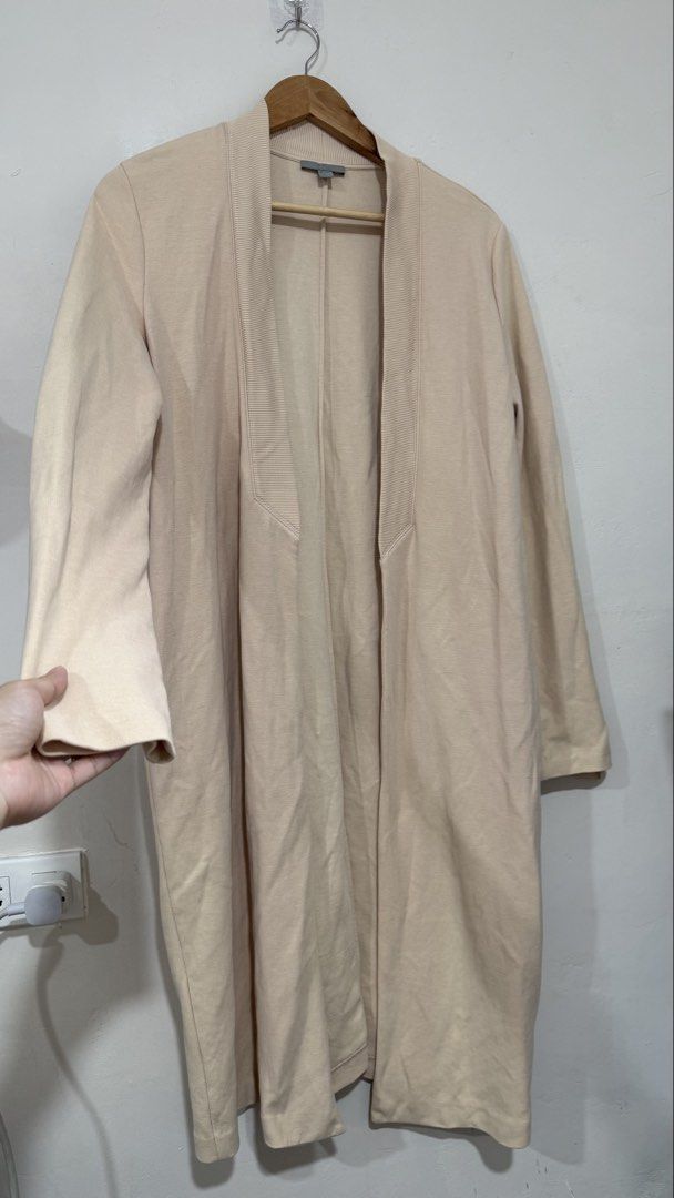 Cos open long line cardigan (Category: Coats, Jackets and Outerwear) located in Manila. Submitted by morningthrifters (Listing ID 1460658809, Image 2). Description: This is a minimalist COS longline open-front cardiganin a versatile beige/tan hue. It features an unlined body, long sleeves, and a distinct, wide ribbed collar that tapers down the front open placket. Medium on tag but can fits large.