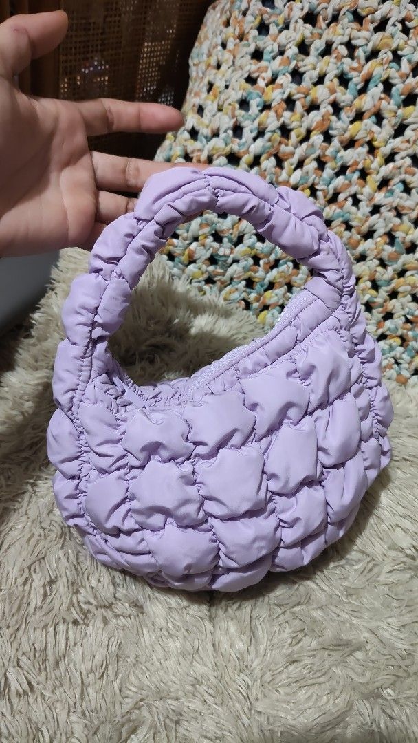 COS...Purple Puffy Cloud Bag...cutify handbag (Category: Shoulder Bags) located in Cebu City. Submitted by lumaynojes00490 (Listing ID 1460534830, Image 2). Description: - Adorable puffy bag in a lovely lavender color. - Soft, cloud-like texture for a luxurious feel. - Comfortable puffy handle, easy to hold. - Ideal size for carrying your daily essentials. - Zipper closure ensures your items are secure. - A fun and trendy accessory to elevate any