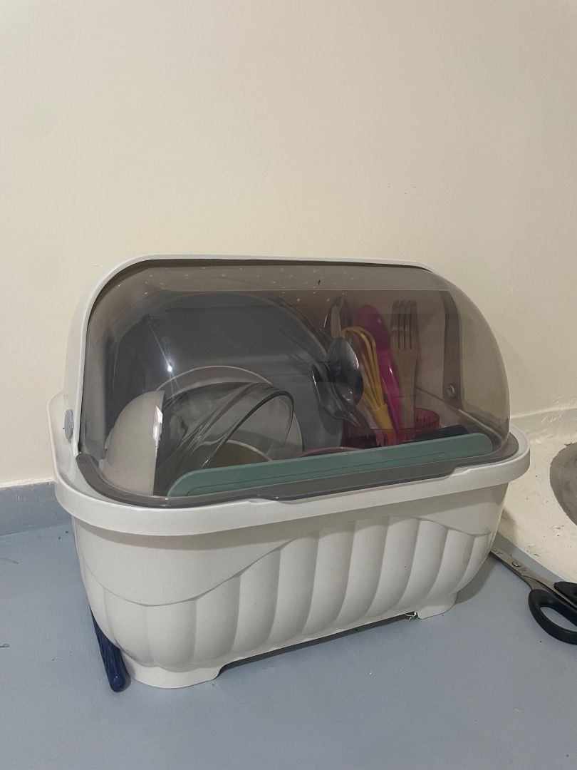 Covered Dish Rack with Utensil Holder (Category: Other Kitchenware & Tableware) located in Caloocan City. Submitted by royalphoenix_7dd2d1 (Listing ID 1460569244, Image 1). Description: - White dish rack with a clear, smoky cover - Keeps dishes organized and dust-free - Separate section for cutlery - Ideal for drying dishes and maintaining a tidy countertop - Compact size fits most kitchens - Easy to clean.