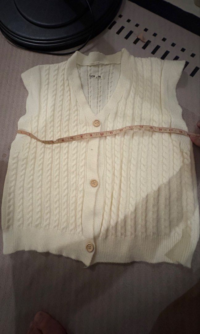 Cream Cable Knit Button Up Vest (Category: Sleeveless) located in Manila. Submitted by valoisjama13821 (Listing ID 1460537776, Image 2). Description: - Cream colored cable knit vest - Sleeveless design - Collared neckline - Three wooden buttons down the front - Ideal for layering over any outfit -large size.