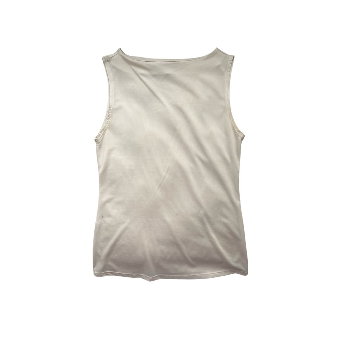 Cream Satin Sleeveless Tank Top (Category: Sleeveless) located in Manila. Submitted by _swaganikaa (Listing ID 1460687492, Image 1). Description: Cream colored sleeveless tank top. Silky satin material. Boat neckline. Great for layering or wearing on its own. Simple and classic piece. Lightweight..