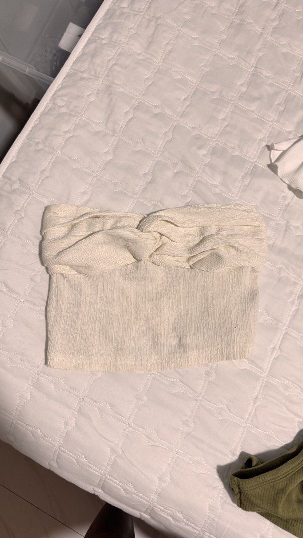 Cream Twist Front Tube Top (Category: Sleeveless) located in Manila. Submitted by wildlion_020304 (Listing ID 1460672933, Image 1). Description: - Chic cream colored tube top - Features a stylish twisted knot detail at the bust - Textured fabric for a unique look - Stretchy material ensures a comfortable, flexible fit - Versatile piece: great for layering or as a standalone top - Effortlessly pairs with jeans, skirts, and more!.