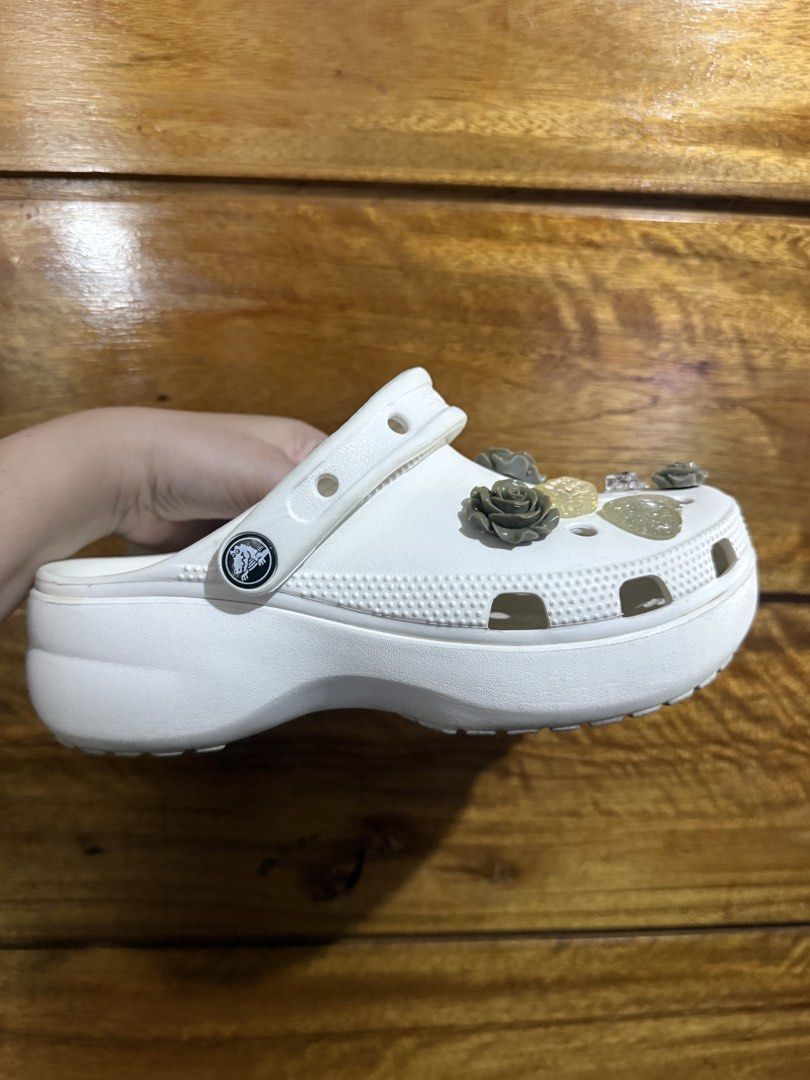 Crocs Classic Platform Clog (Category: Slippers and slides) located in Paranaque City. Submitted by bubblycheekfinds (Listing ID 1460643293, Image 2). Description: - White platform Crocs - Decorated with cute rose and heart charms - Easy slip-on design - Ideal for casual wear - Fun and stylish footwear.