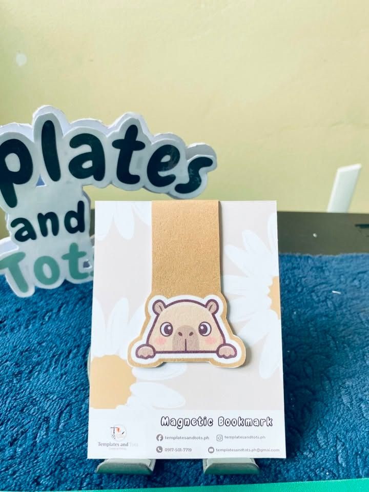 Cute Magnetic Bookmarks - Capybara, Ghost, Books (Category: Other Stationery & Craft) located in Caloocan City. Submitted by templatesandtots_ph (Listing ID 1460577942, Image 1). Description: - Keep your place in style with these adorable magnetic bookmarks. - Choose from three fun designs: a peeking capybara, a ghost reading, or a stack of books with 'just one more chapter'. - Easy to use and a delightful addition for any book lover. - Makes a g
