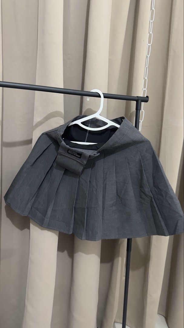 Dark Grey Pleated Mini Skirt (Category: Skirts) located in Taytay. Submitted by _daphnnie.21 (Listing ID 1460612259, Image 2). Description: Dark grey pleated mini skirt with a small pocket and front button/zip closure. Perfect for casual wear or school uniform/cosplay looks..