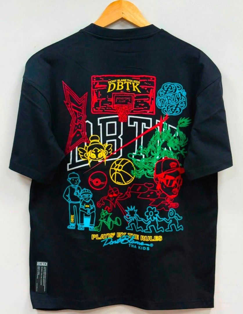 DBTK Black Graphic T-Shirt (Category: Tshirts & Polo Shirts ) located in Cavite. Submitted by samthingtowearsimpystylish (Listing ID 1460568769, Image 1). Description: - Black DBTK T-shirt ovrrns - Vibrant basketball-themed graphic print on the back featuring characters and DBTK logo - Small DBTK logo graphic on the front - Ideal for casual wear.
