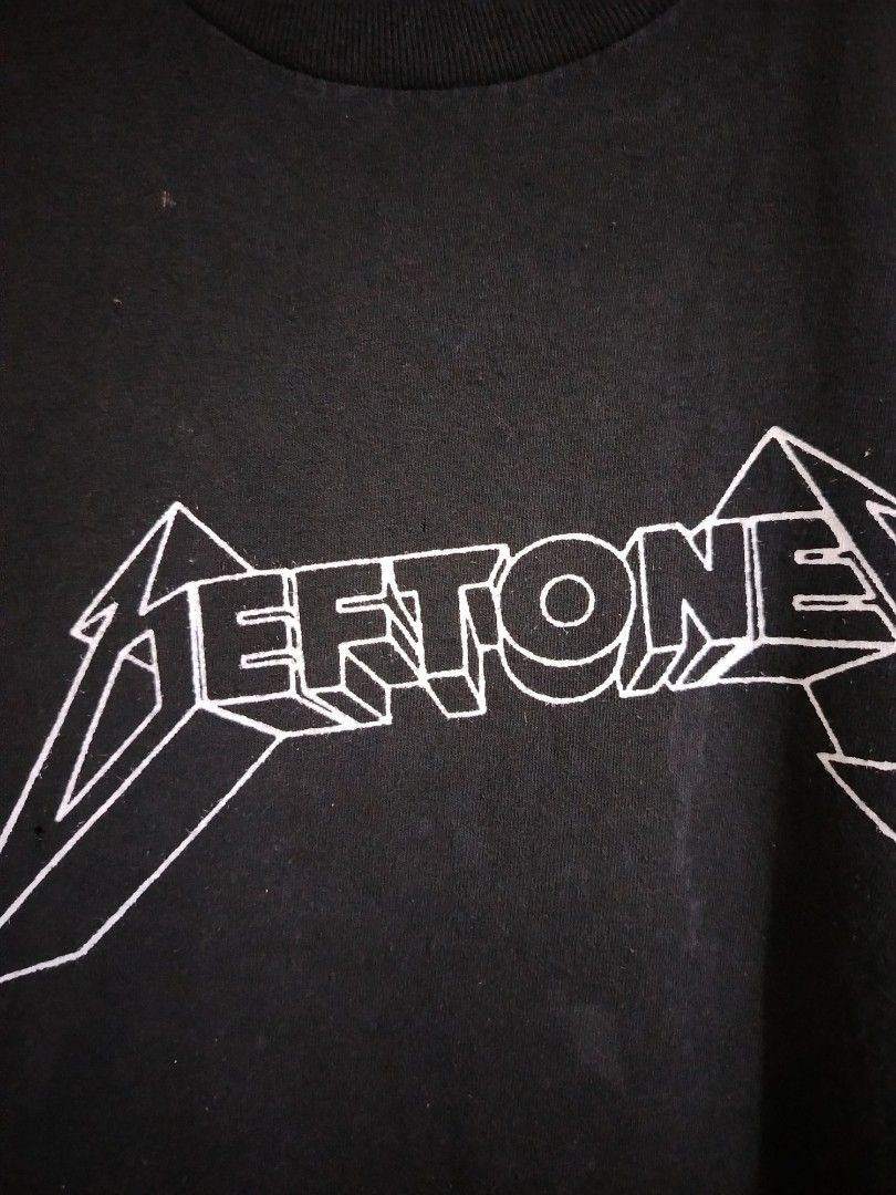 Deftones Band T-Shirt Black (Category: Tshirts & Polo Shirts ) located in Cavite. Submitted by koyawell.ph (Listing ID 1460665619, Image 2). Description: - Black Deftones t-shirt - White 3D logo print - XL 24 x 30 dimensions - Small hole on front near logo - Slightly faded collar - Ideal for Deftones fans.