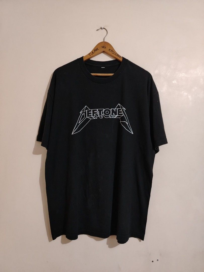 Deftones Band T-Shirt Black (Category: Tshirts & Polo Shirts ) located in Cavite. Submitted by koyawell.ph (Listing ID 1460665619, Image 1). Description: - Black Deftones t-shirt - White 3D logo print - XL 24 x 30 dimensions - Small hole on front near logo - Slightly faded collar - Ideal for Deftones fans.