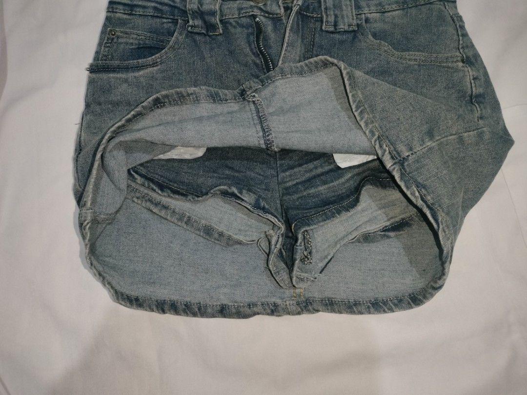 Denim Mini Skirt 26-27 (Category: Skirts) located in Quezon City. Submitted by mccchs (Listing ID 1460655004, Image 3). Description: waist: 26-27 length: 13 - with inner short - has minor flaw (yellowish stain, see at last slide) - color may vary due to lighting.