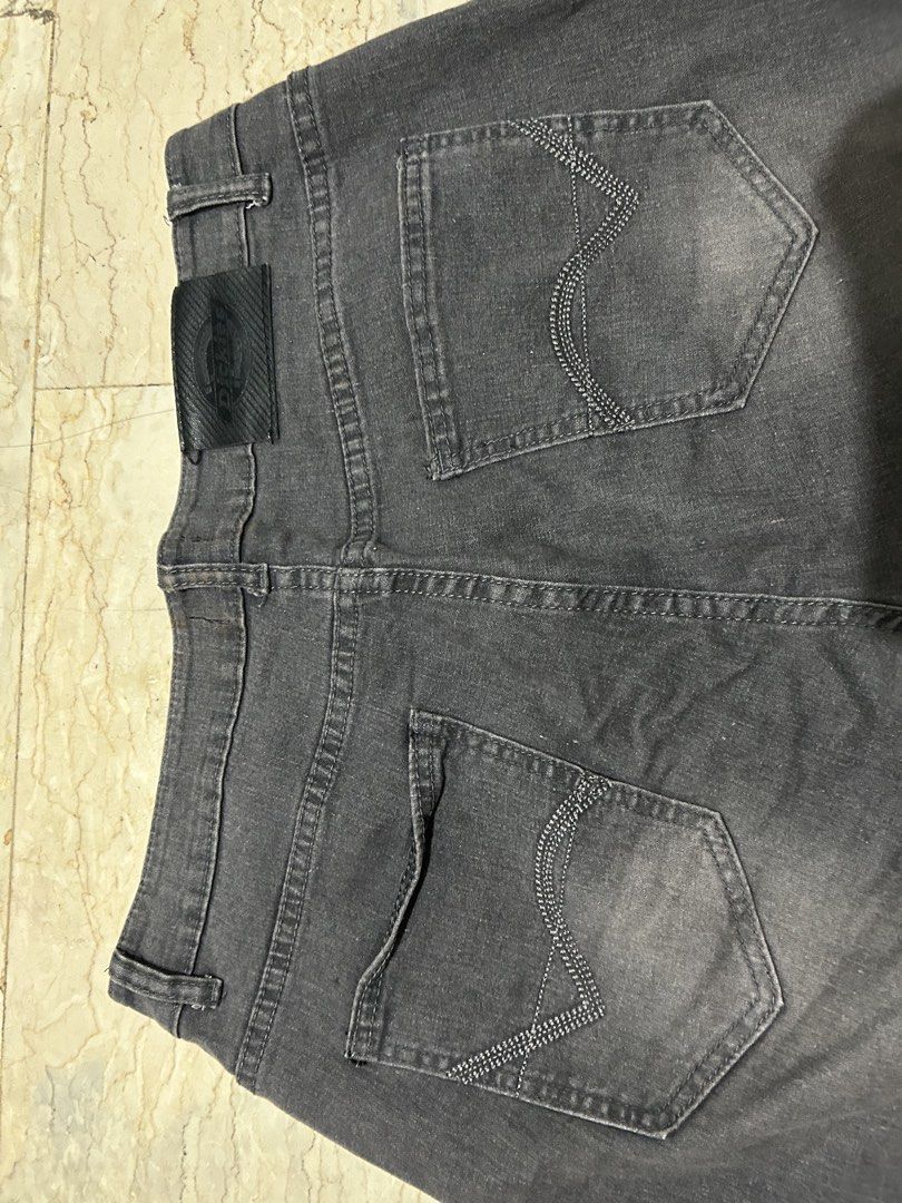 Dickies Grey Denim Jeans (Category: Jeans) located in Mandaluyong City. Submitted by 0lg2026 (Listing ID 1460691134, Image 3). Description: - Classic grey Dickies jeans - Signature Dickies logo patch on the back - Two back pockets with stitching detail - Button and zip front closure - Ideal for everyday casual wear.